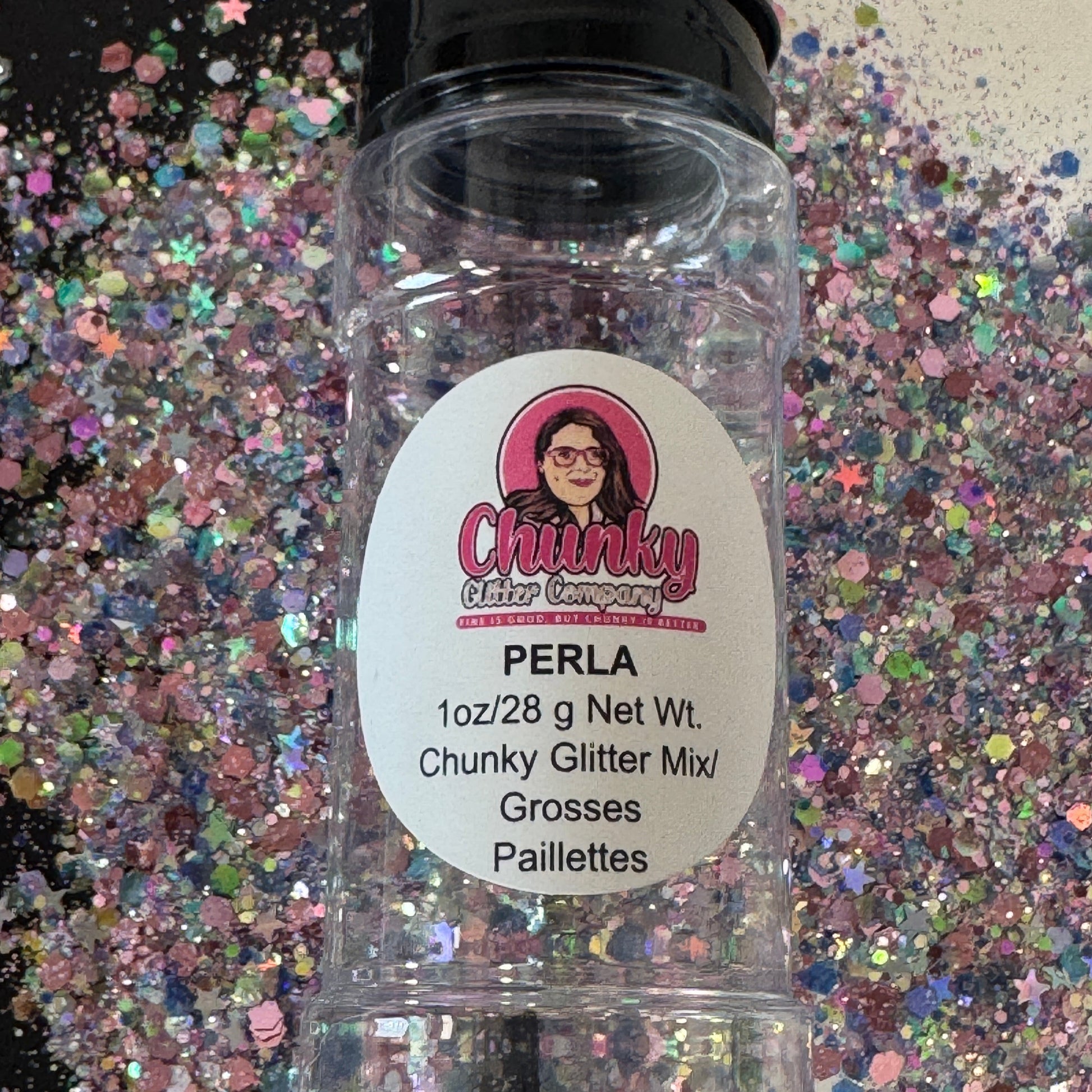 A clear plastic bottle with a label showing 'Perla' by Chunky Glitter Company, containing a Light Light Pink/Rainbow/Blue  with Hexagon and Star chunky glitter mix.