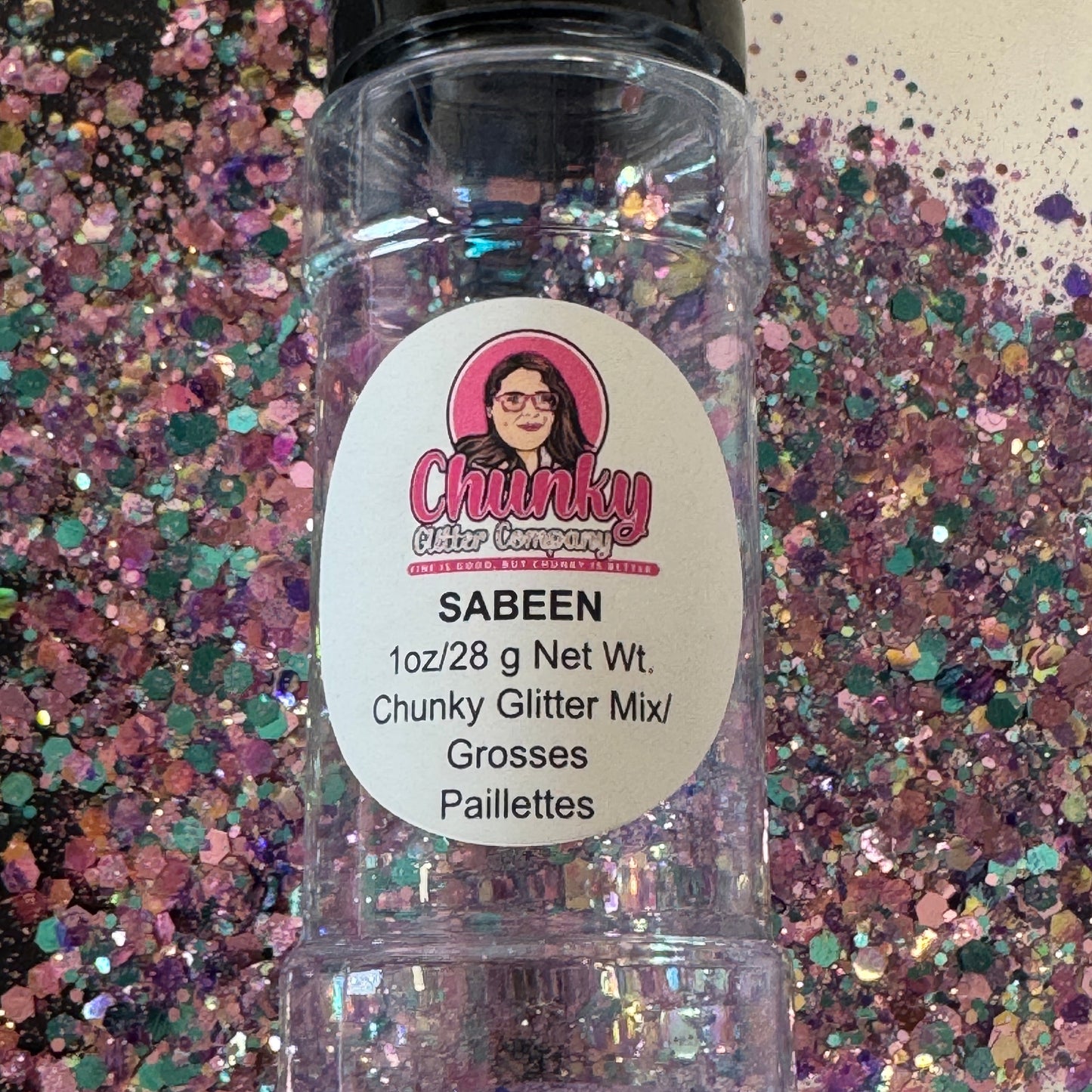 A clear plastic bottle with a label showing 'Sabeen' by Chunky Glitter Company, containing a Light Light Pink/Purple/Blue chunky glitter mix.