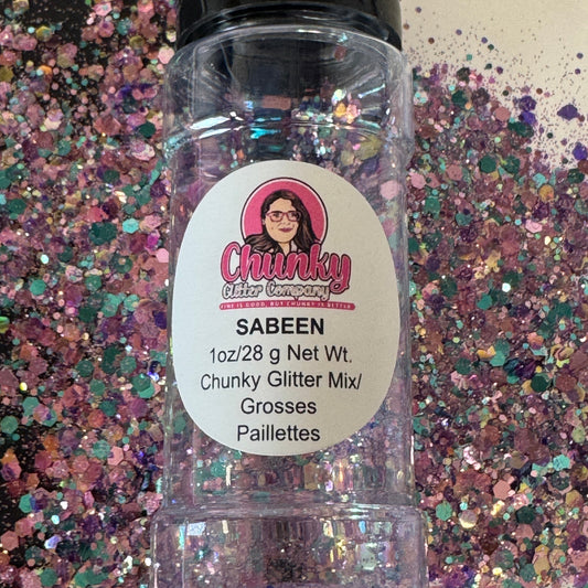 A clear plastic bottle with a label showing 'Sabeen' by Chunky Glitter Company, containing a Light Light Pink/Purple/Blue chunky glitter mix.