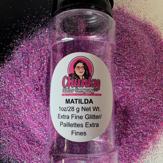 A clear plastic bottle with pink glitter inside, labeled 'Matilda' with the Chunky Glitter Company brand.
