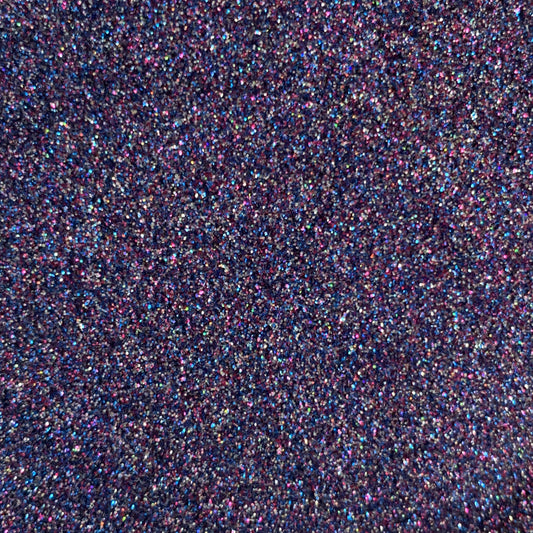 Close-up view of dark purple glitter with holographic highlights reflecting various colors.