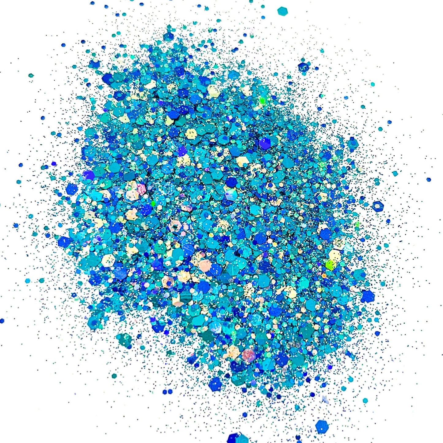 A pile of blue and turquoise colored chunky glitter, spread out on a surface.