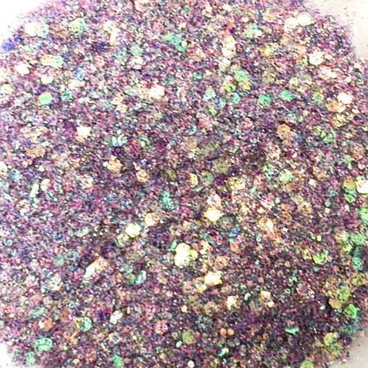 A pile of mixed colours of chunky glitter, including White/Aqua/Purple/Blue/Pink/Navy  on a white background.