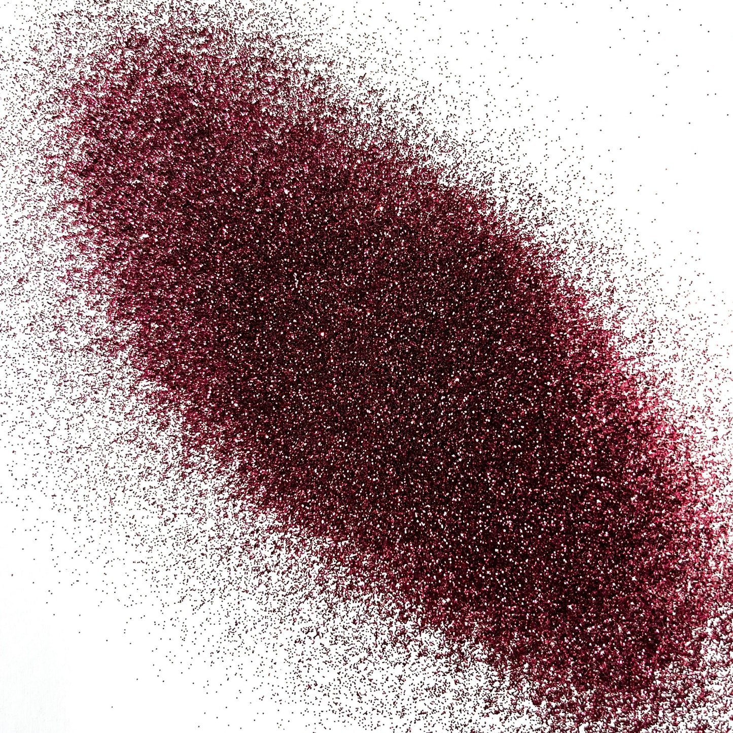 An extra fine maroon glitter pile on a white background.