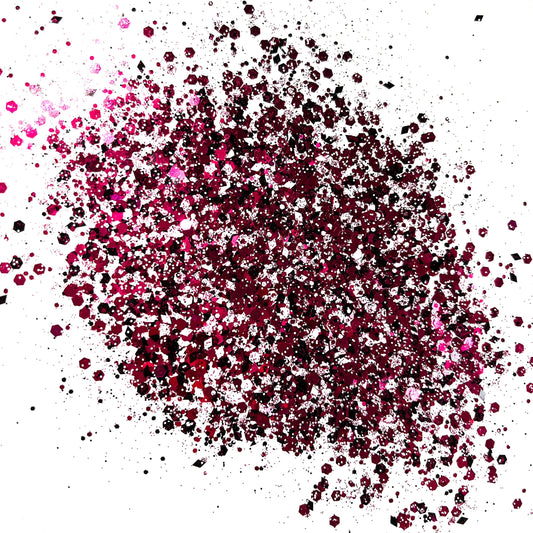 A pink/bkack/white chunky glitter mix on a white background.
