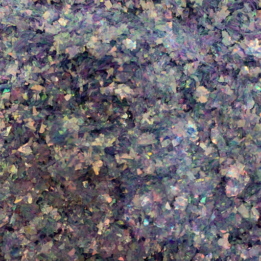 A close-up image of a blue, pink, green, irregular cut glitter mix.