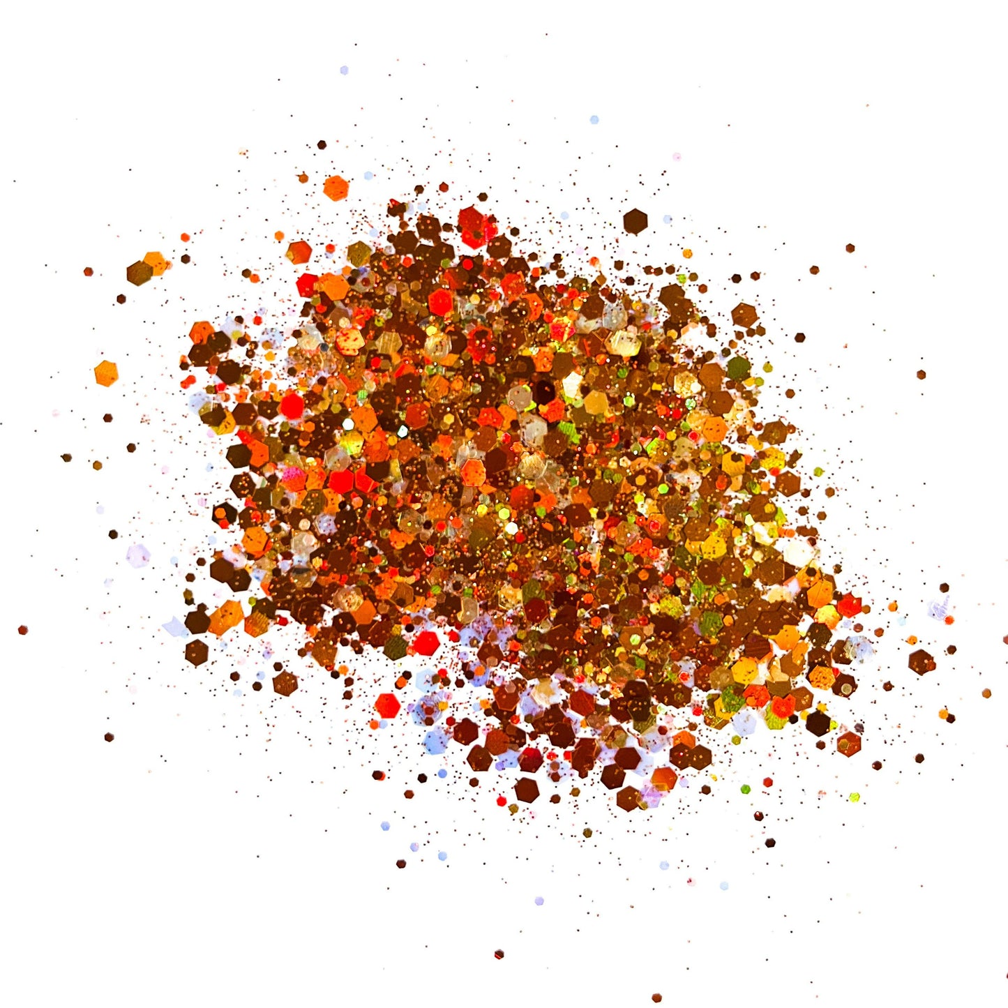 A pile of multicolored glitter, with shades of brown, orange, and yellow predominating.