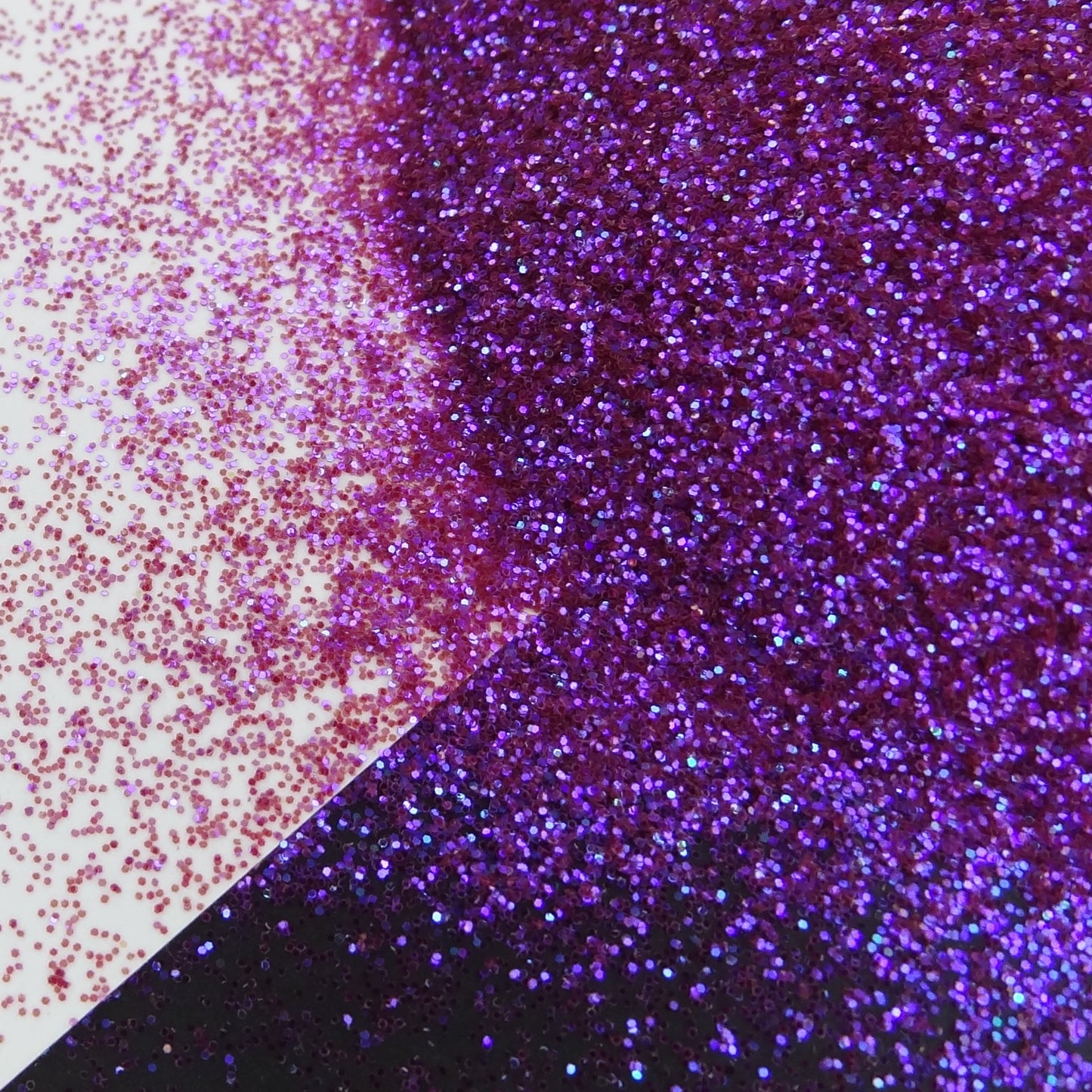 A purple glitter mix spread out on a black and white background.