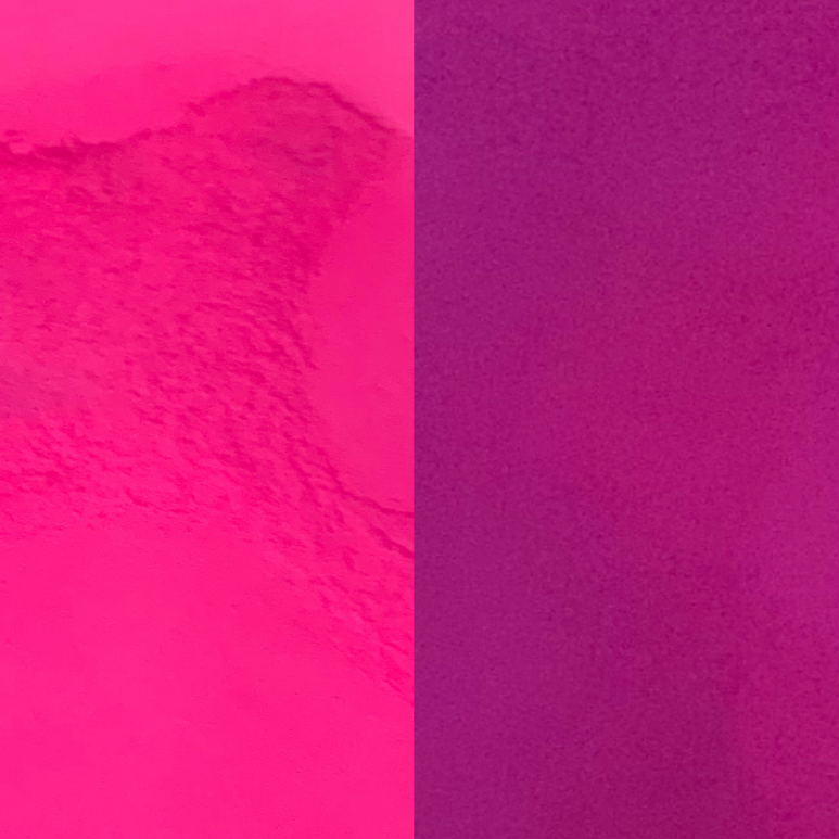 An image showing pink glow in the dark powder plain and glowing.