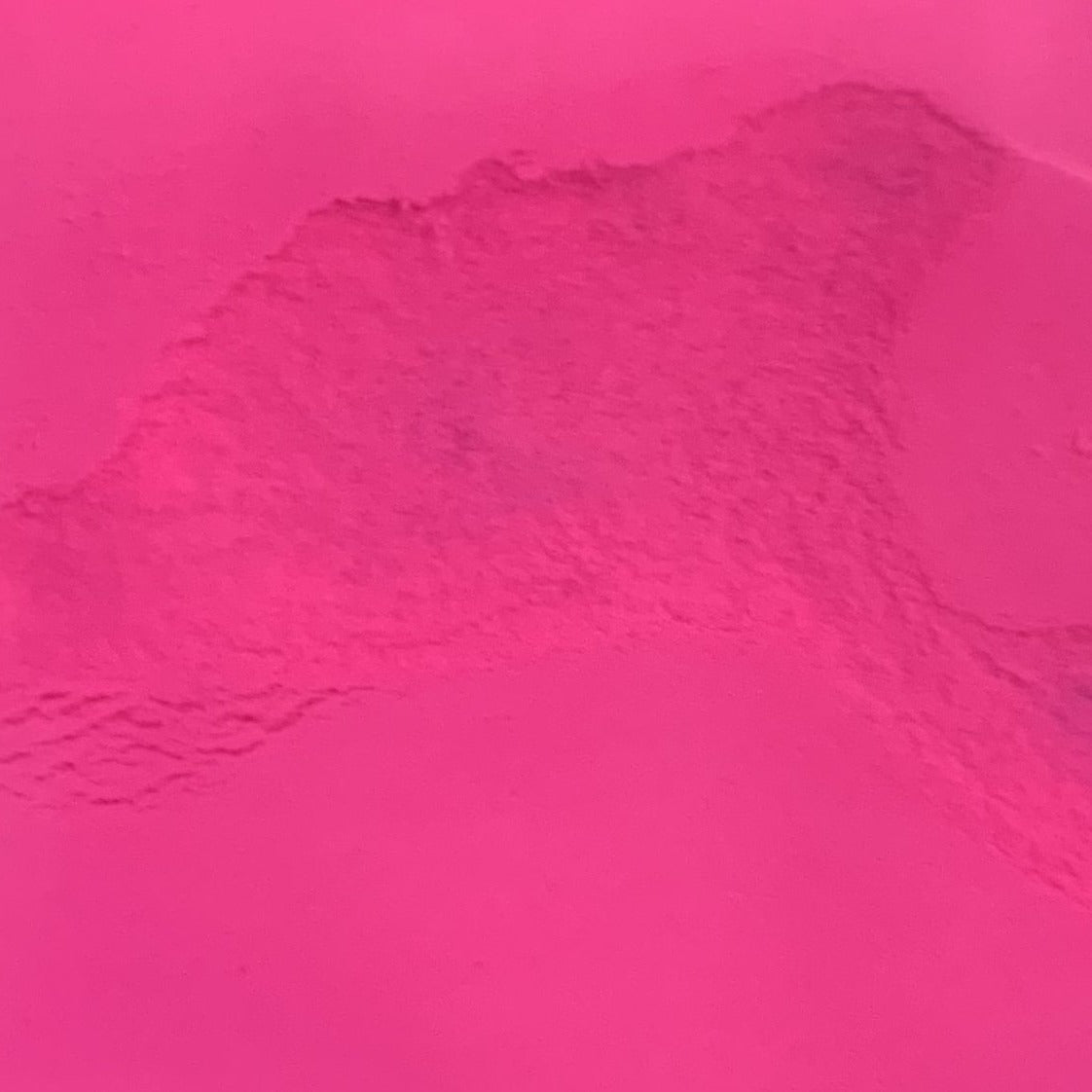 An image showing pink glow in the dark powder.