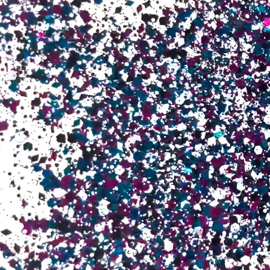 A pile of mixed colours of chunky glitter, including Black/White/Pink/Blue with Hexagons and Diamonds on a white background.