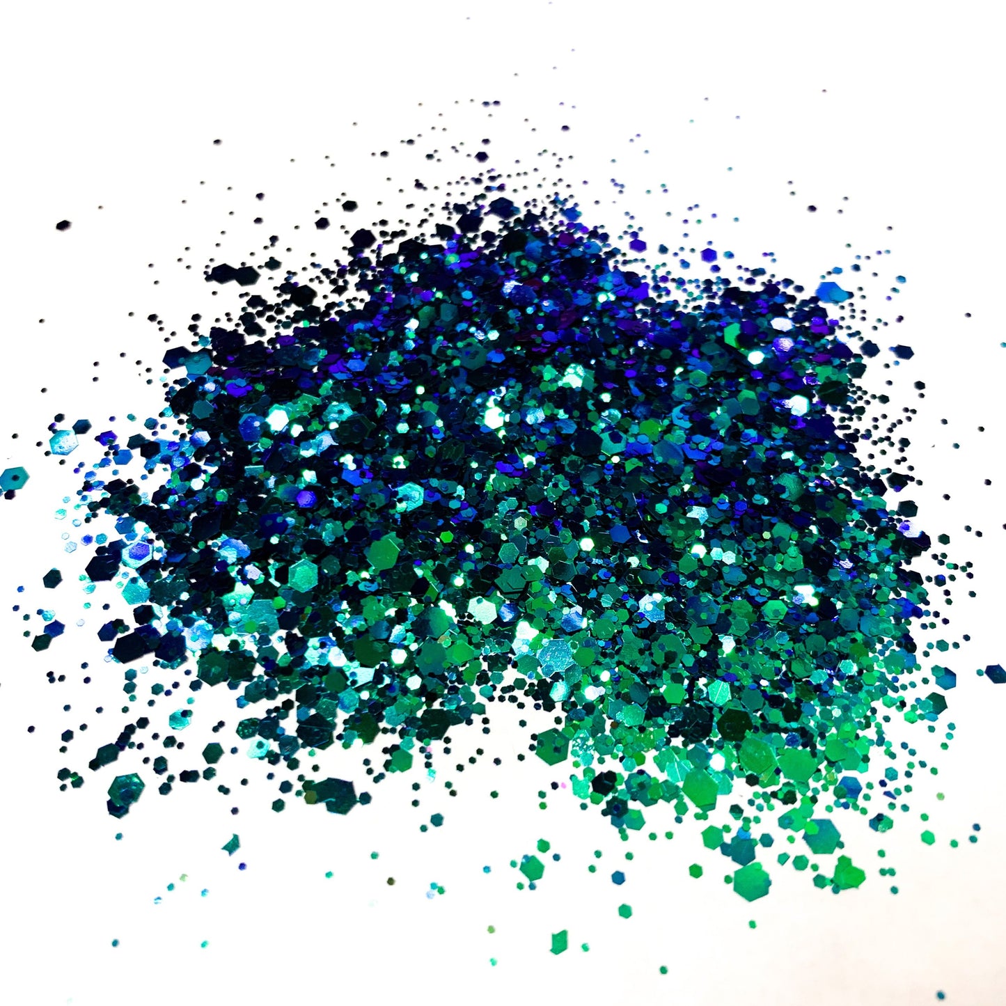 A blue/turquoise chameleon colour shift glitter on a white background.