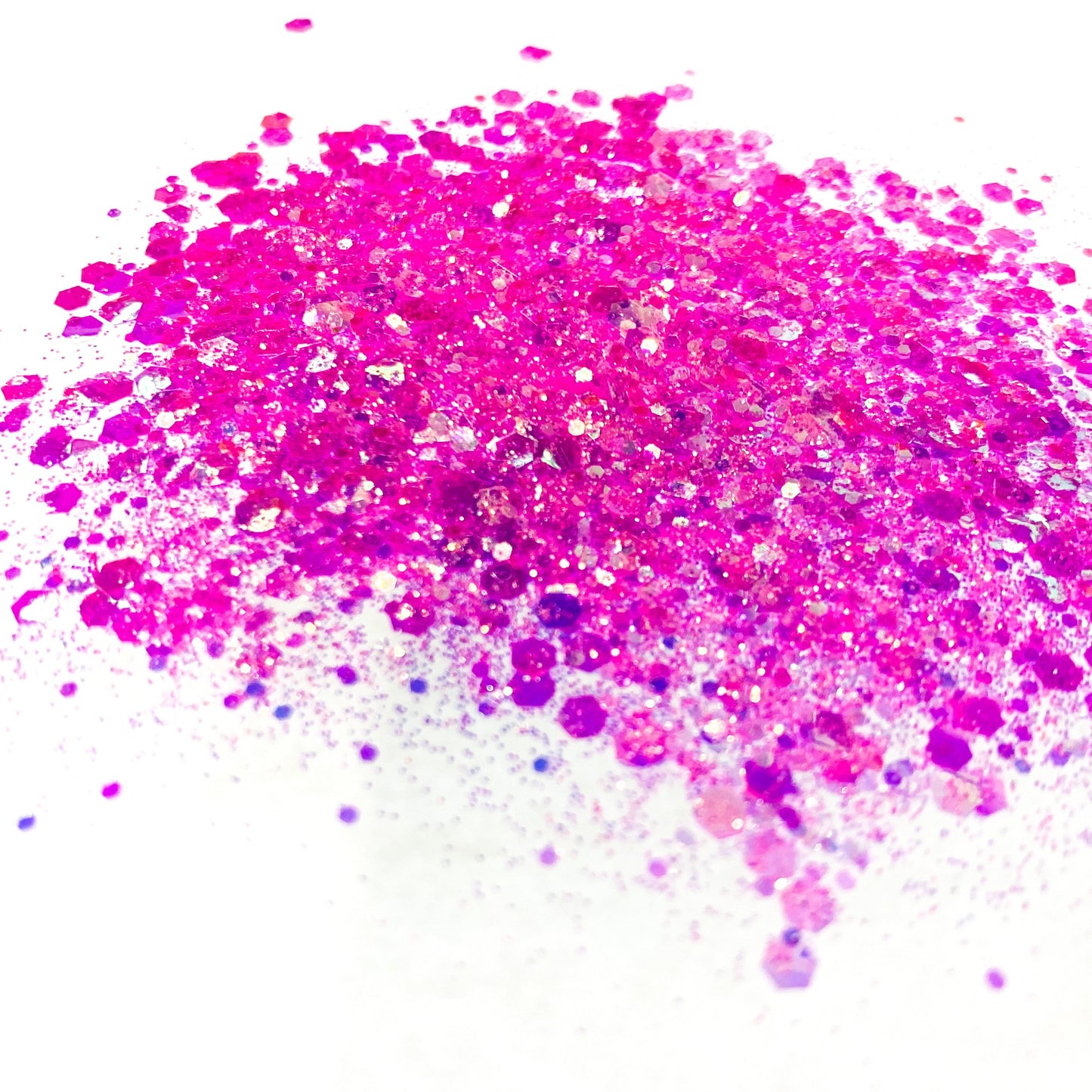 A pink chunky glitter mix on a white background.