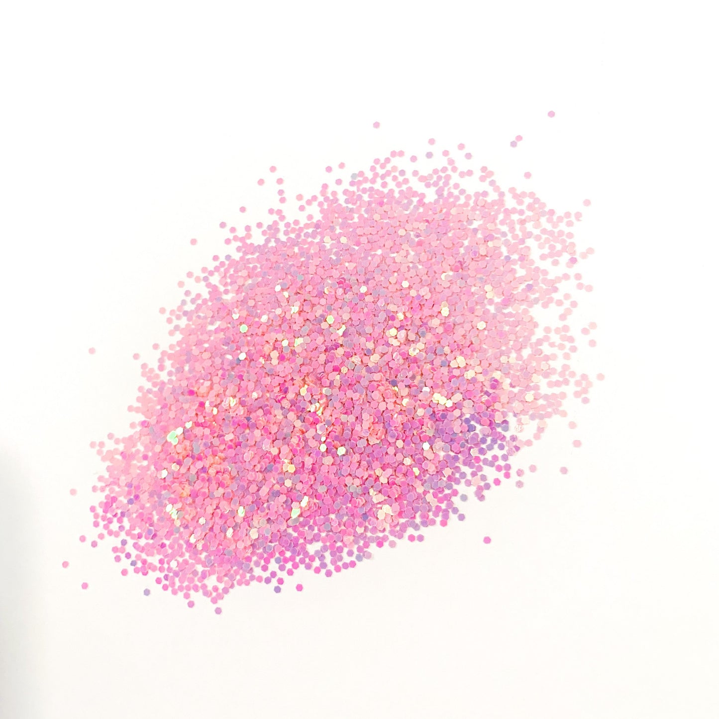 A pile of pink medium cut chameleon glitter on a white background