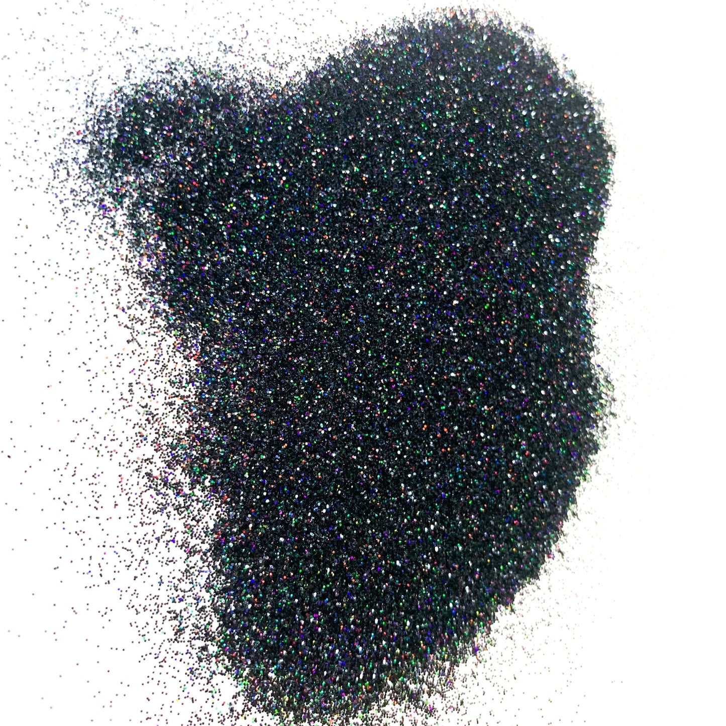 A pile of dark glitter on a white background.