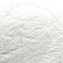 A close-up image of extra fine white glitter distributed on a surface, resembling the texture of icing sugar with sparkles.