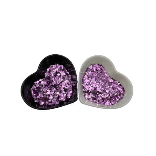 Two heart shaped containers, one black, one white, containing a Light Purple chunky glitter mix.