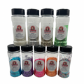 A collection of nine jars of glitter in various colors, labeled with names such as 'Philip' and 'Lucy', intended for use in snowglobe tumblers.