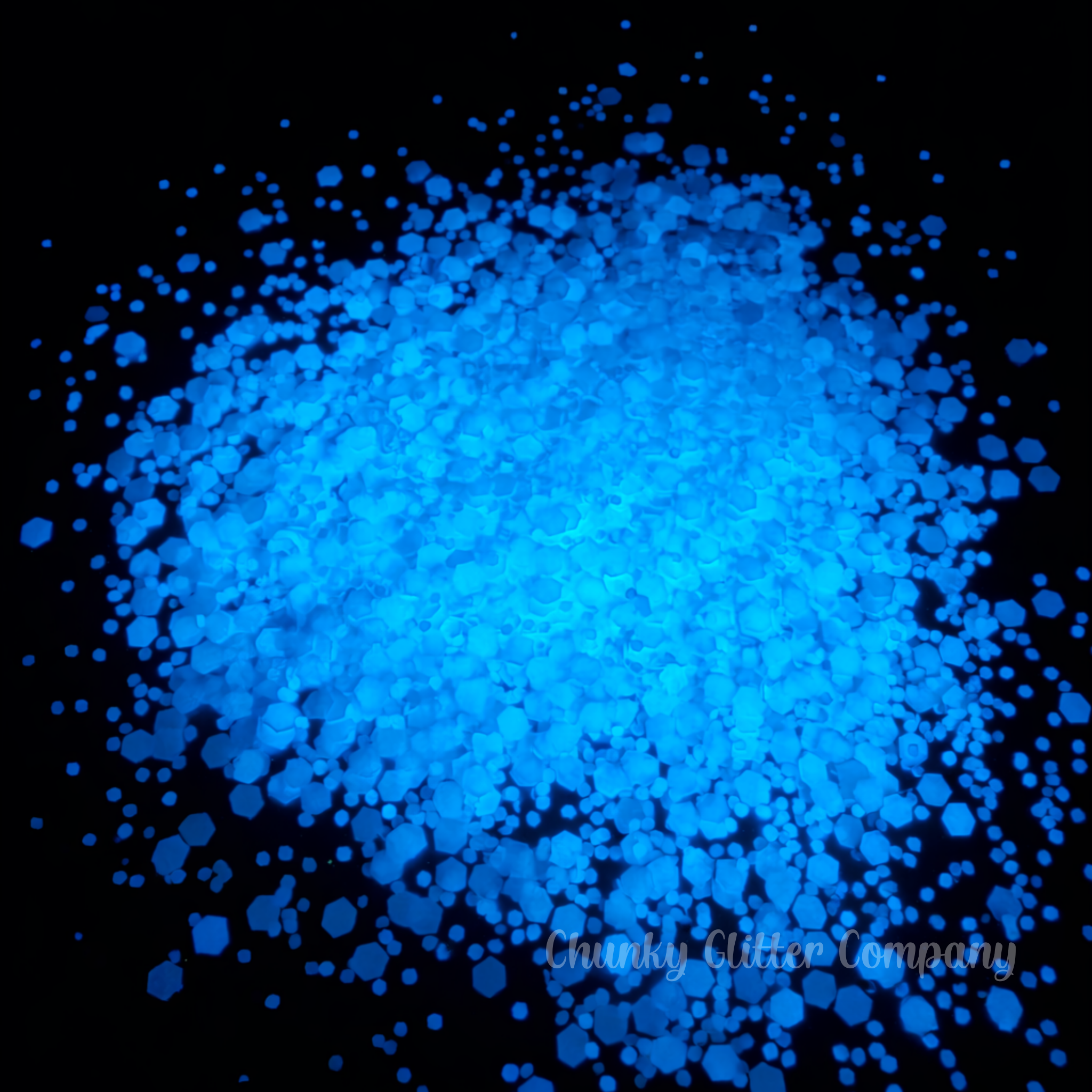 Blue glowing glitter on a black background with 'Chunky Glitter Company' branding.