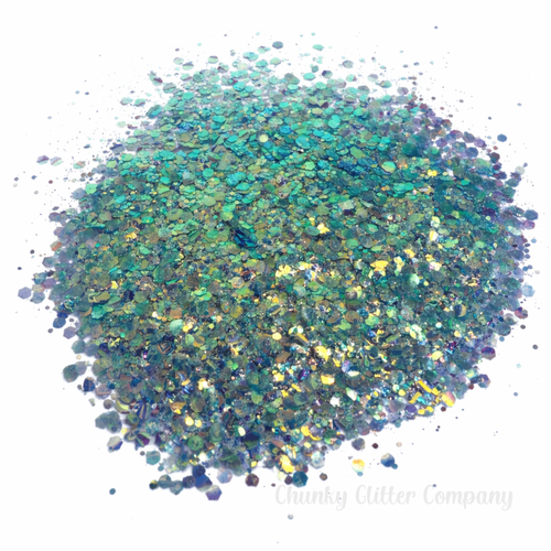 Blue iridescent chunky glitter on a white background with the branding "Chunky Glitter Company"