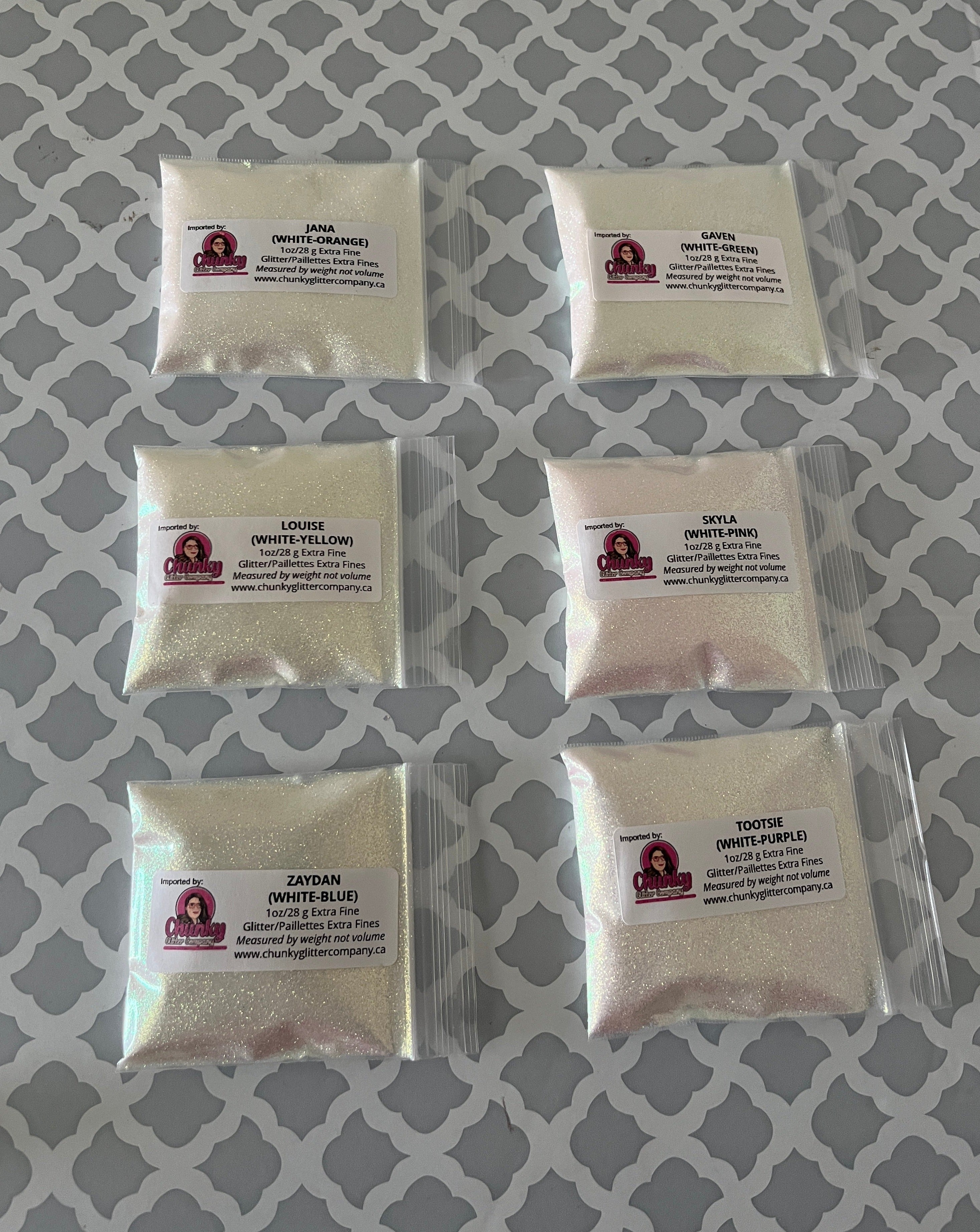 6 packages of white glitter that changes colour in the sunight.