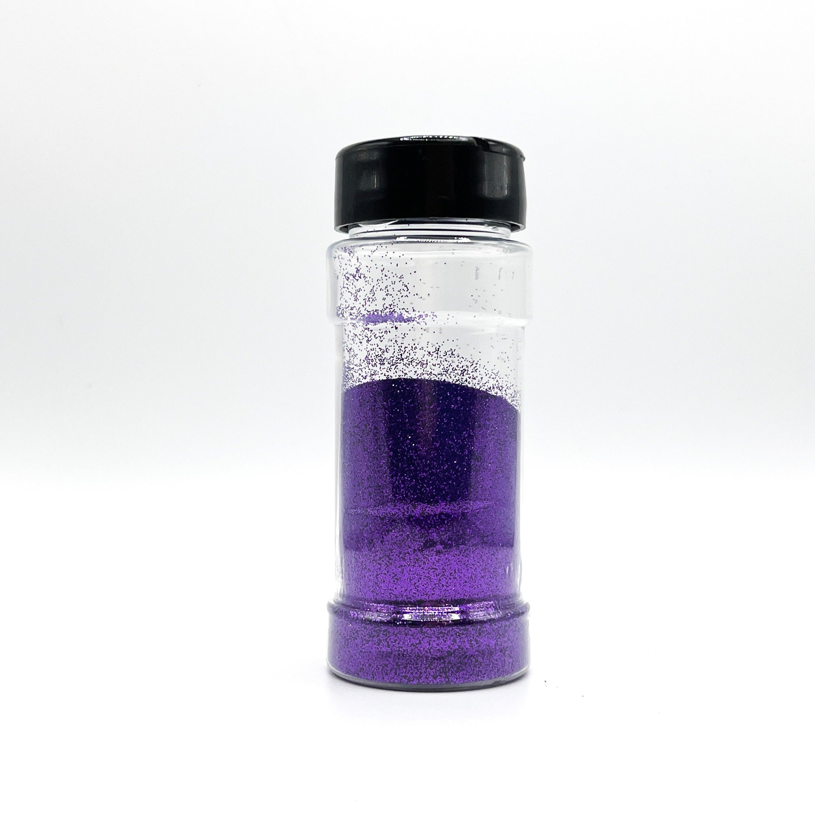 A 2oz jar containing 1oz of extra fine glitter with a black cap.