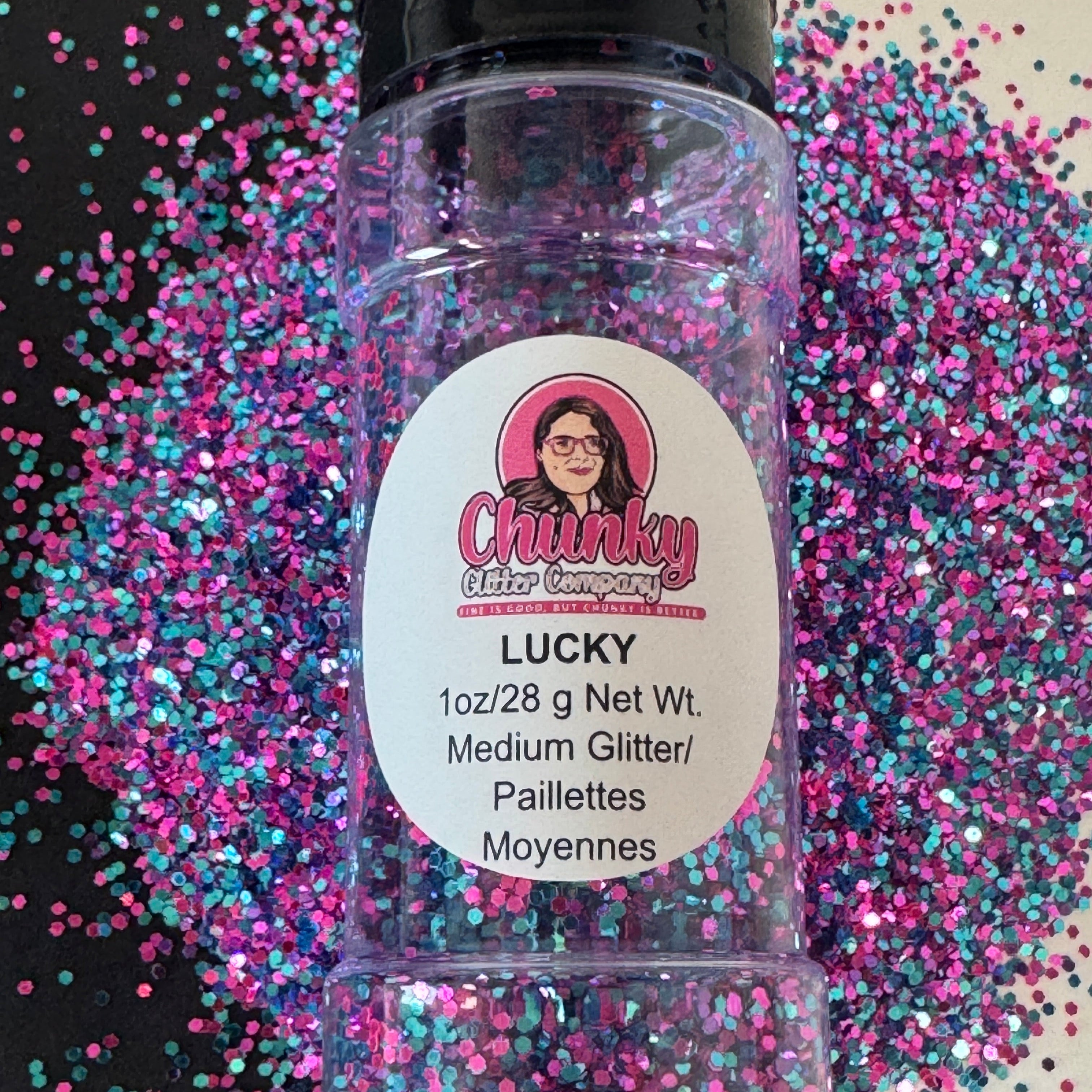A clear plastic bottle with a label showing 'Lucky' by Chunky Glitter Company, containing a Light Pink/Purple/Blue medium glitter.