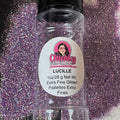 A clear plastic container labeled 'Lucille' filled with purple extra fine glitter, with the brand Chunky Glitter Company displayed on the label.