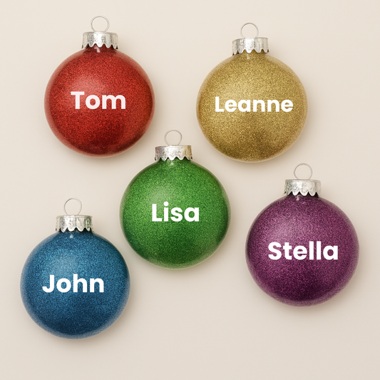 5 disc shaped glitter ornaments with the names Tom, Leanne, Lisa, John & Stella.