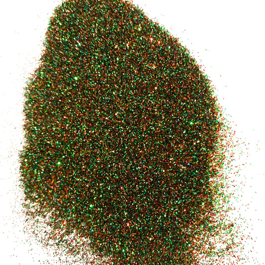 A green/orange  extra fine glitter on a  white background.