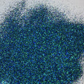 A close-up image of extra fine mix glitter showcasing various blues and greens.