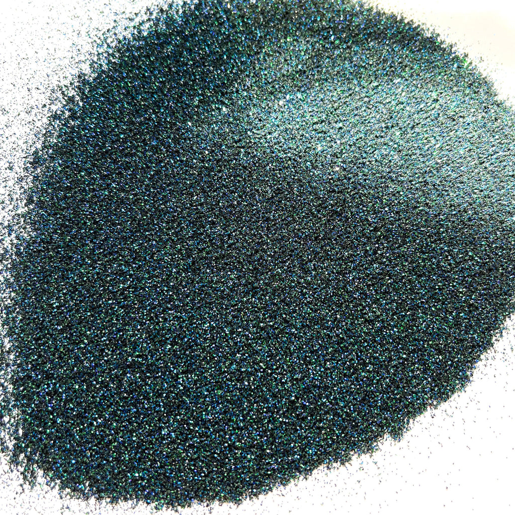 A dark extra fine glitter mix on a white background.