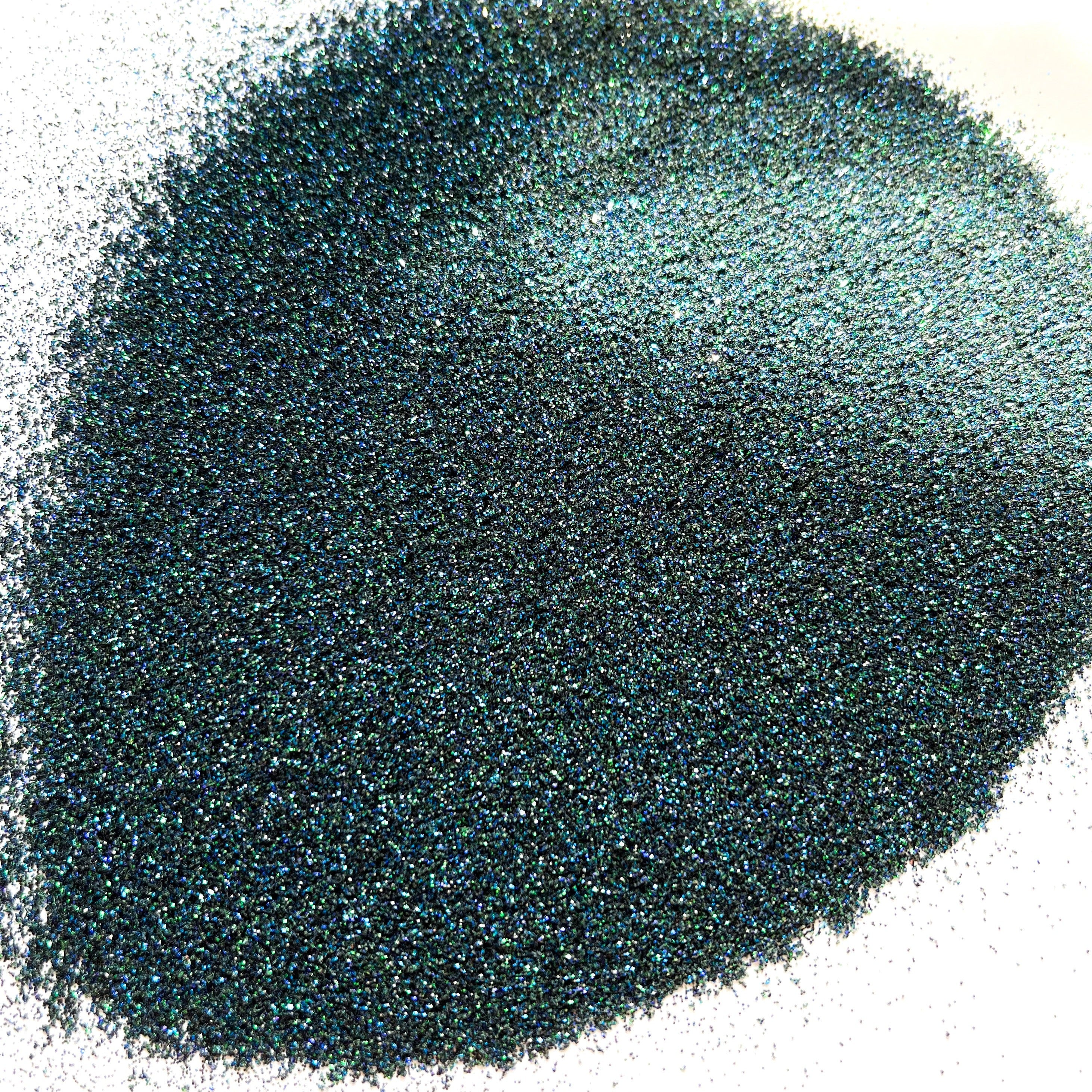 A dark extra fine glitter mix on a white background.