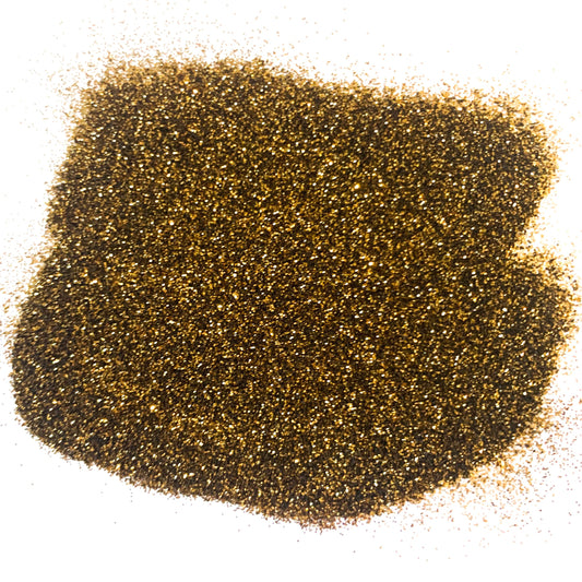 A pile of brown, extra fine glitter spread out on a surface.