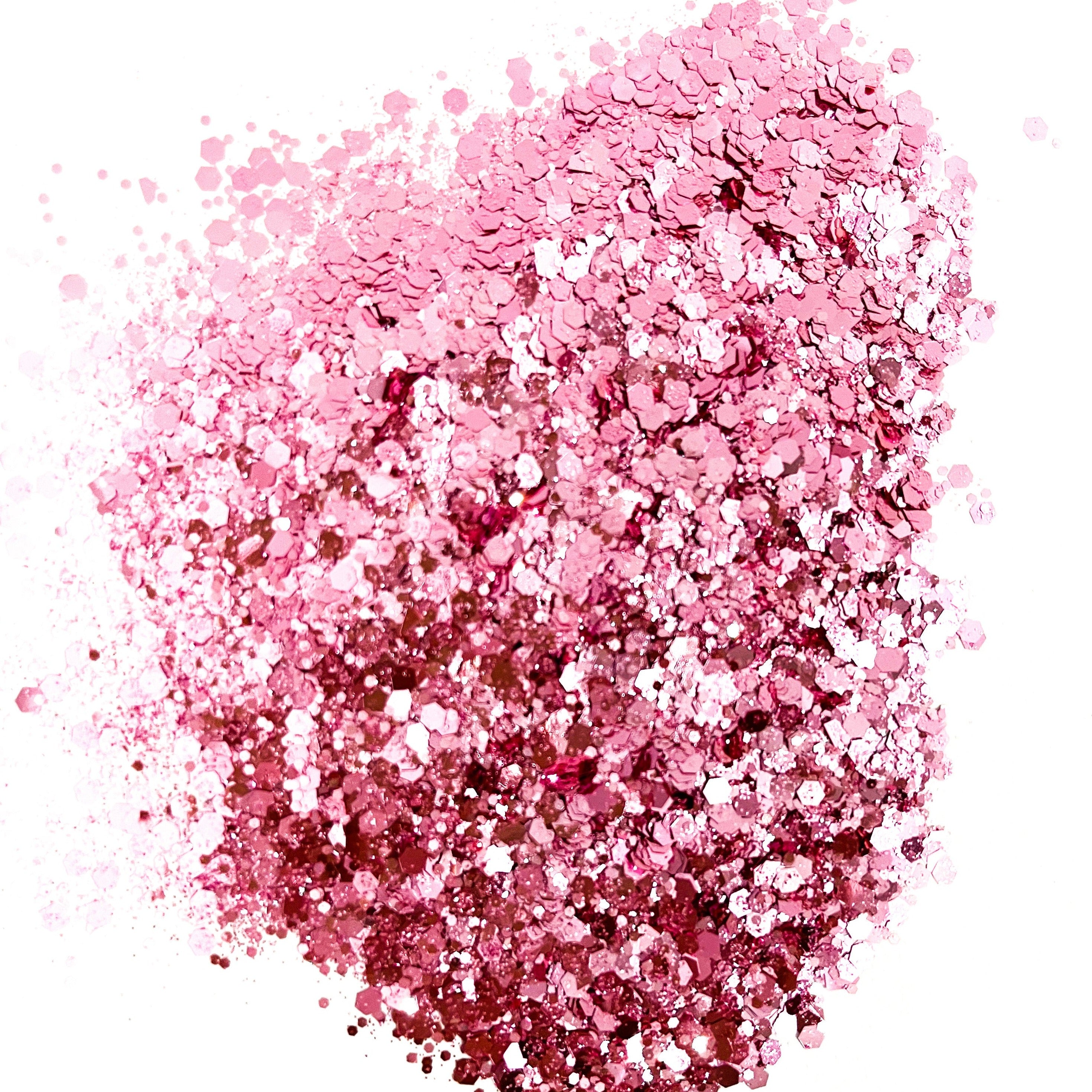 A pile of light pink chunky glitter on a white background.