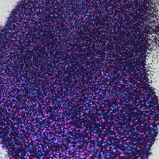 A close up of a pink and blue extra fine glitter mix.