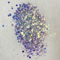 A close-up image of opal white chunky glitter spread on a surface.