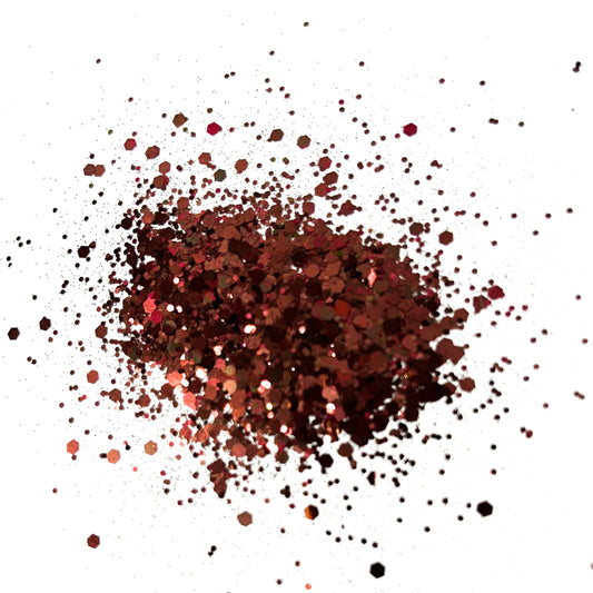 A pile of chocolate brown chunky glitter on a white background.
