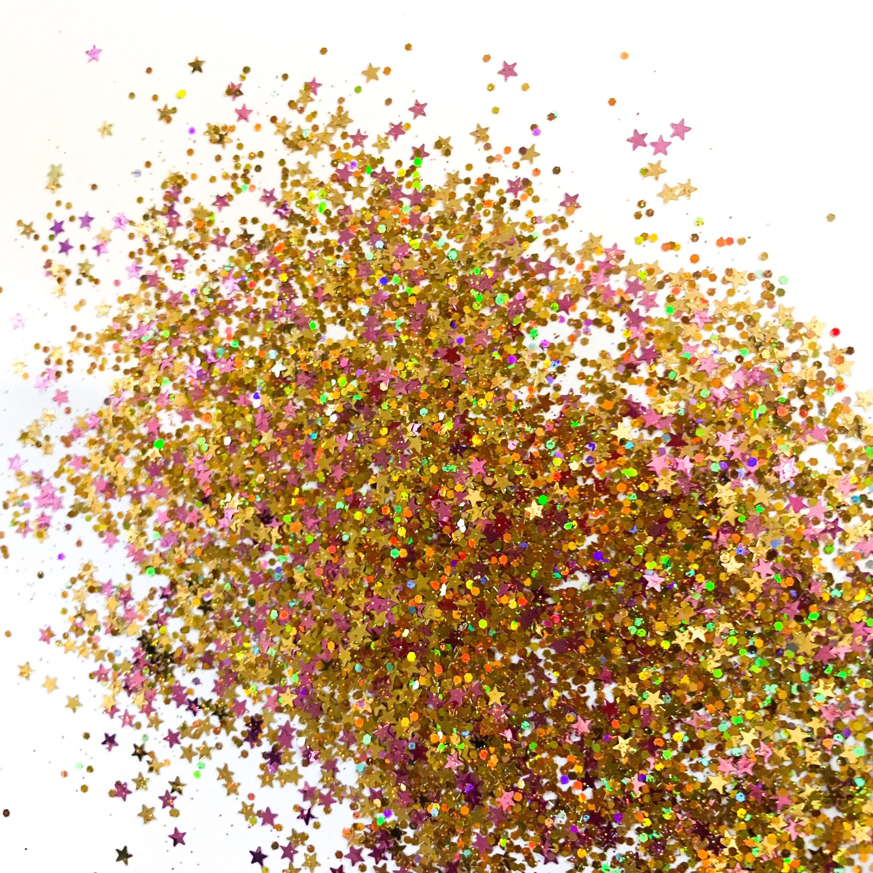 A burst of multicolored star-shaped glitter against a white background.