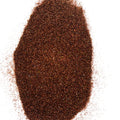 A pile of brown, extra fine glitter with a holographic finish.