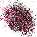 A pink/bkack/white chunky glitter mix on a white background.