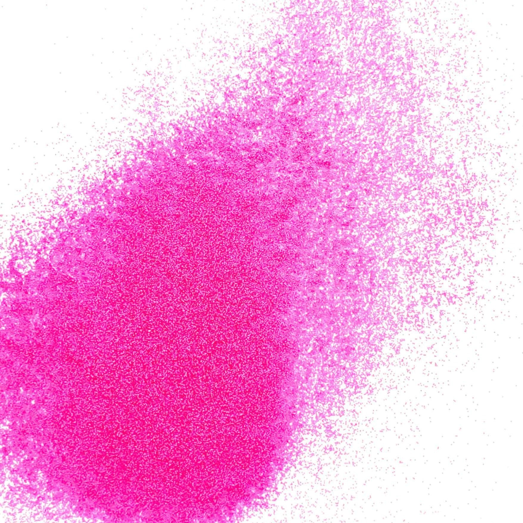 A pile of bright pink, extra fine, fluorescent glitter, with a matte finish.