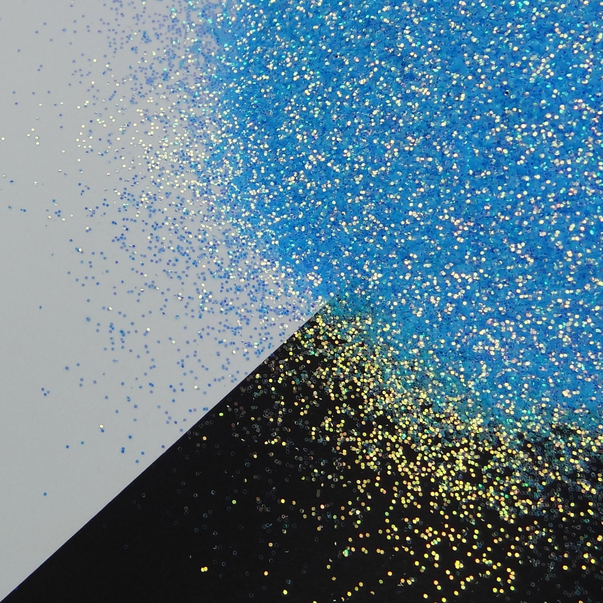 A blue glitter mix spread out on a black and white background.