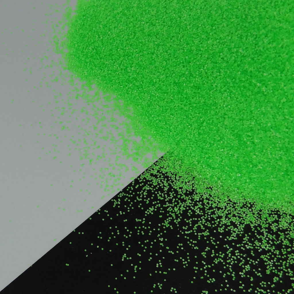 A pile of green, extra fine, fluorescent glitter, with a matte finish.