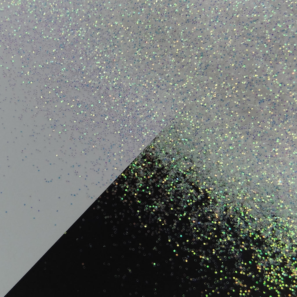 A white extra fine glitter mix spread out on a black and white background.