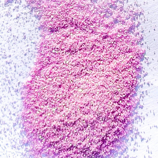 A light pink extra fine glitter on a white background.