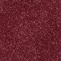 A close up red and pink extra fine glitter mix.