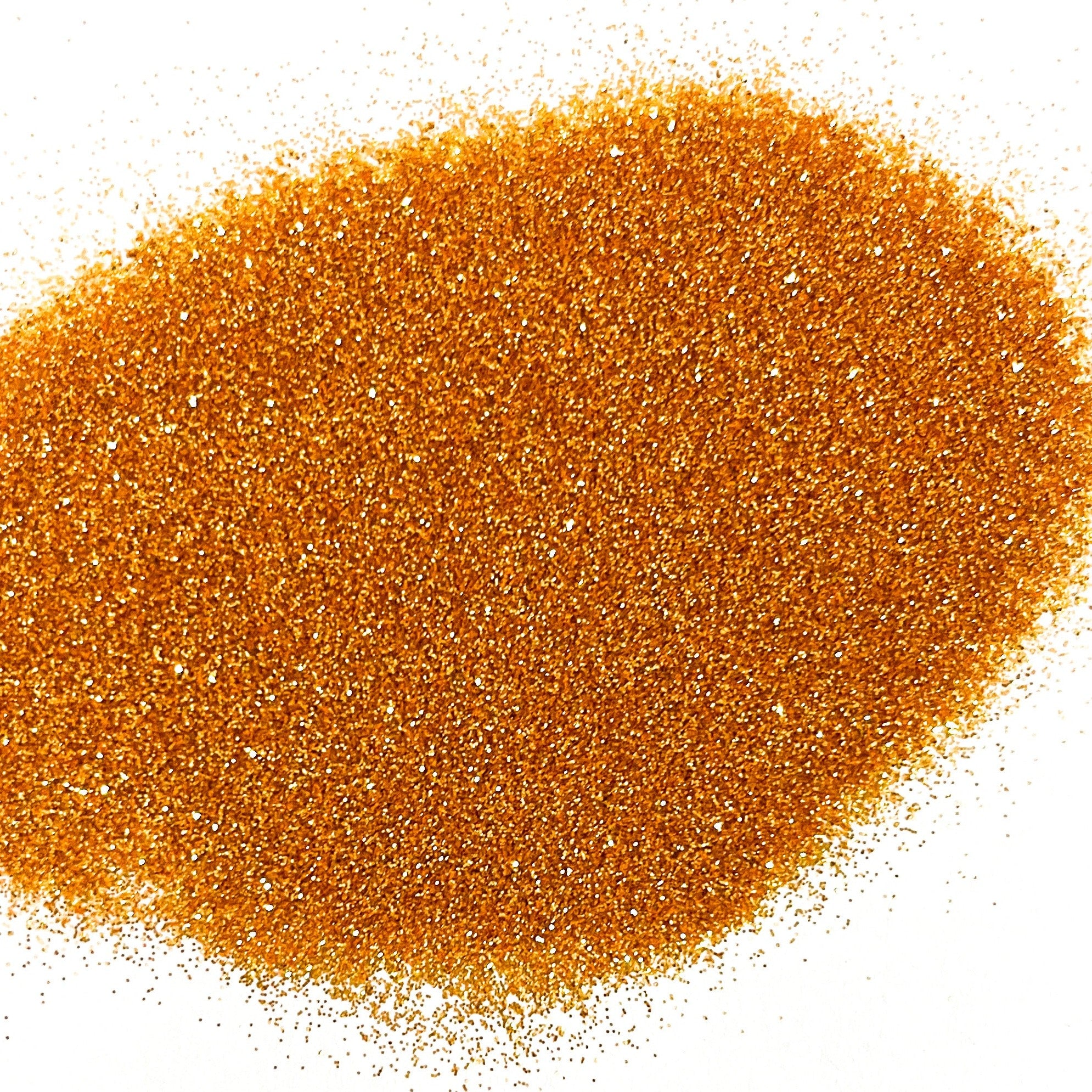 A pile of orange metallic glitter on a white background