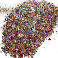 A close-up view of a collection of multicolored glitters, resembling a kitchen sink mix, with various sizes and colors.