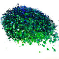 A green/blue chameleon colour shift glitter on a white background.